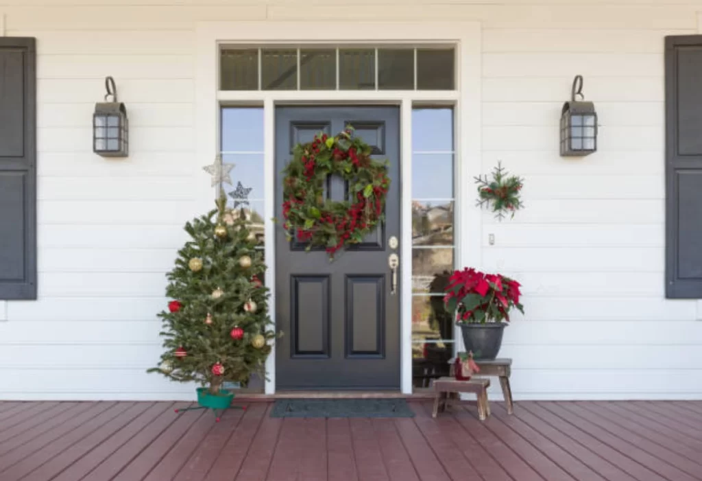 A House door with christmas tree and wreath 