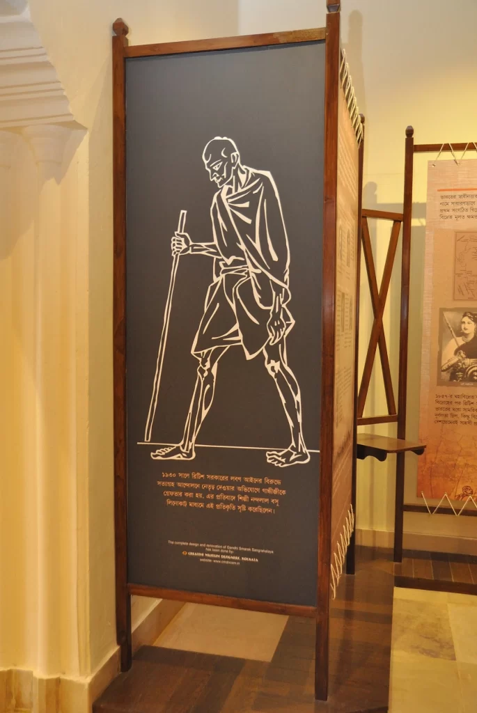 A Print of Mahatma Gandhi walking with a stick 