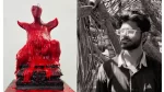 A sculpture by Aryan Nandakishor Patil featuring a red, dripping figure seated on a traditional base, juxtaposed with a black-and-white portrait of the artist standing amidst a bamboo structure.