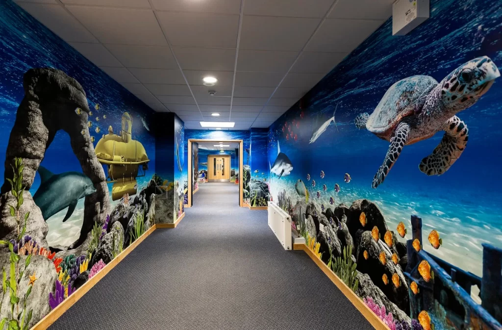 Wall art featuring acquatic animals like turtle and whales 