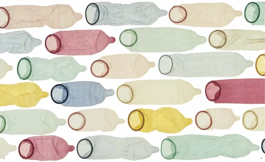 An image with a lot of coloured condoms 