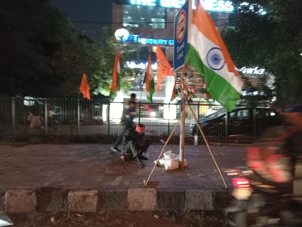 A man selling the Indian flag during Republic Day by Babra Shafiqi